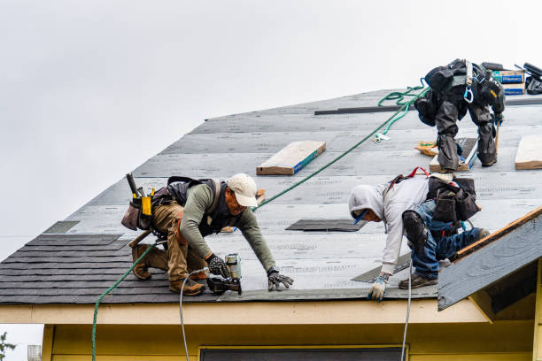 Professional Gutter Installation technician working in Easton, MA